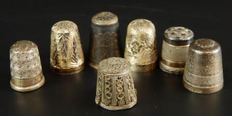 A collection of white metal and other thimbles