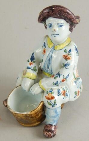 A Continental Delft tin glazed earthenware figure