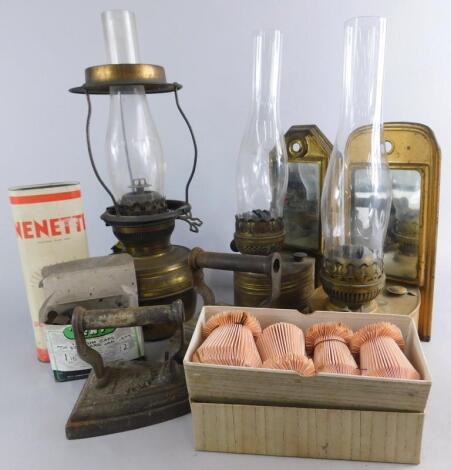 Two wall mounted paraffin oil lamps