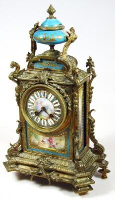 A 19thC French gilt metal and porcelain mantel timepiece