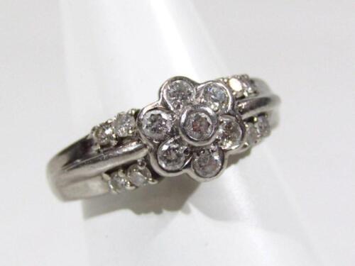 A platinum and diamond floral dress ring