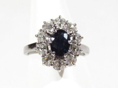 A sapphire and diamond floral cluster dress ring