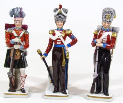 A set of three Sitzendorf porcelain figures of dragoons