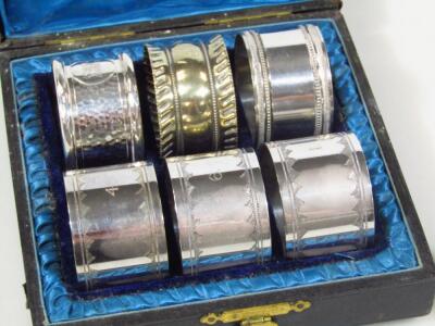 Four various silver napkin rings - 3