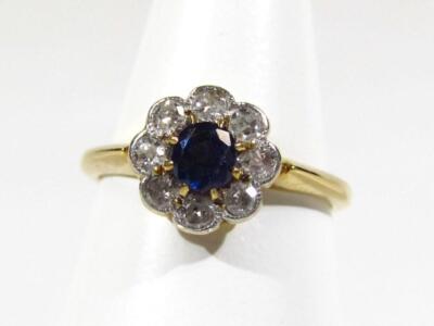 A sapphire and diamond cluster ring.