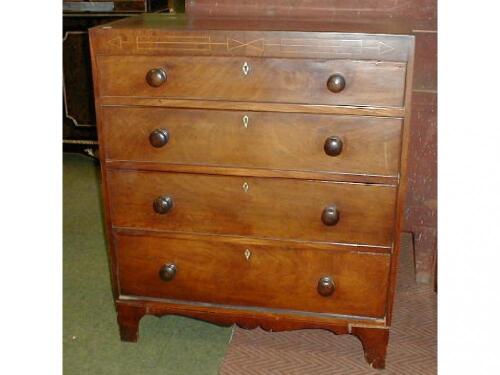 An early 19thC mahogany chest of four graduated drawers with knob handles and bracket feet