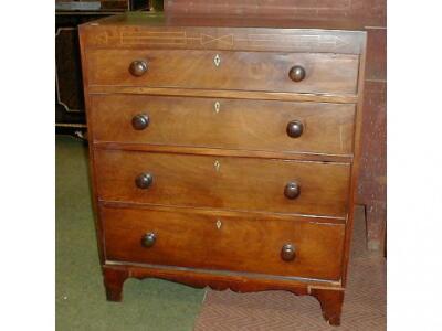 An early 19thC mahogany chest of four graduated drawers with knob handles and bracket feet