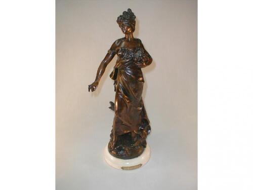 A cold painted Spelter figure of a female