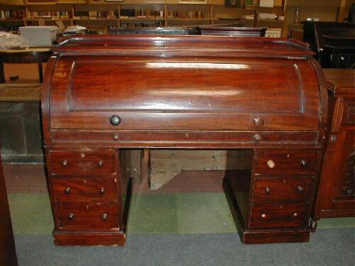 A Victorian mahogany roll top estate desk with fully fitted interior