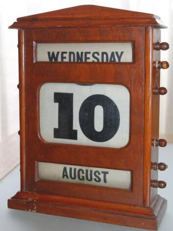 A mid 20thC mahogany cased table calendar