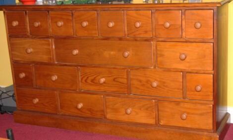 A modern pine finished spice cabinet