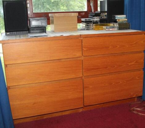 Two modern teak three drawer cabinets