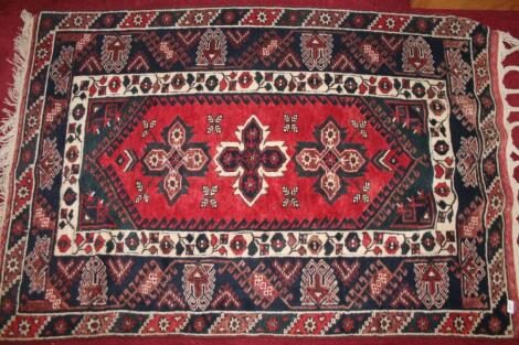 A 20thC hand woven Mihrab rug