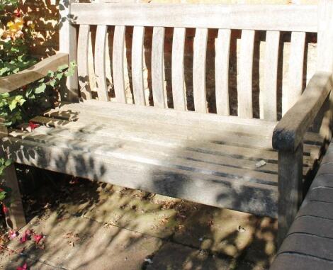 A modern slatted garden bench