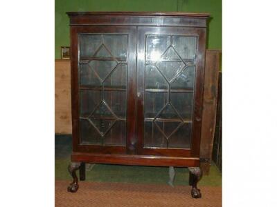 A 19thC mahogany two door display cabinet with lozenge astrigals and seated