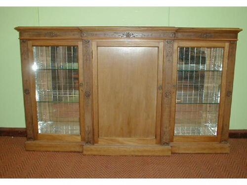 A Victorian walnut breakfront side cabinet with scratch carved decoration