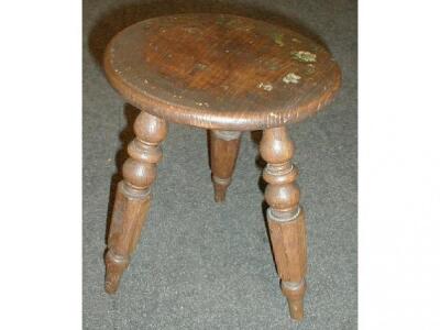 A Victorian painted elm tripod stool