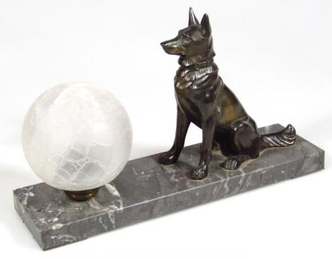 A mid 20thC spelter glass and marble finish dog lamp