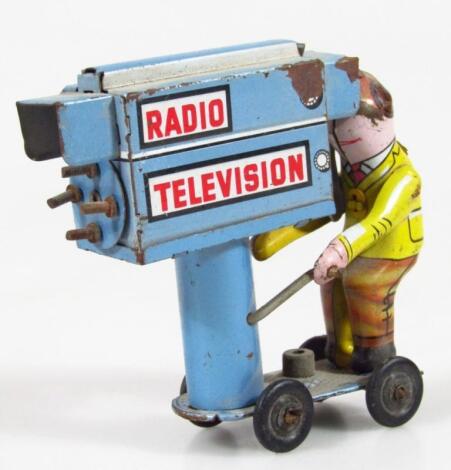 A mid 20thC tin plate radio television cameraman toy