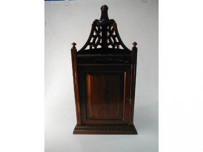 A late Victorian walnut hanging corner cabinet with dentil moulded cornice