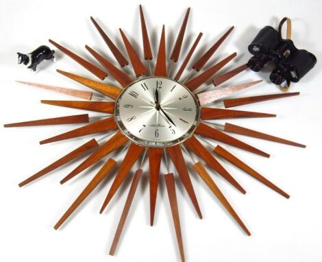 A modern retro style teak and metal Starburst clock