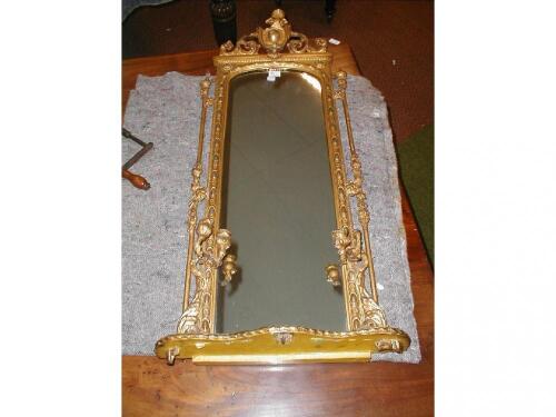 A 19thC gilt wood and gesso pier glass with foliate shield pediment