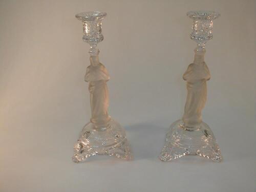 A pair of Continental pressed glass candlesticks