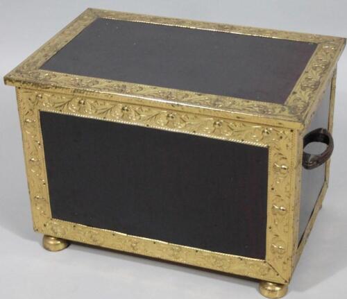 A brass slipper box