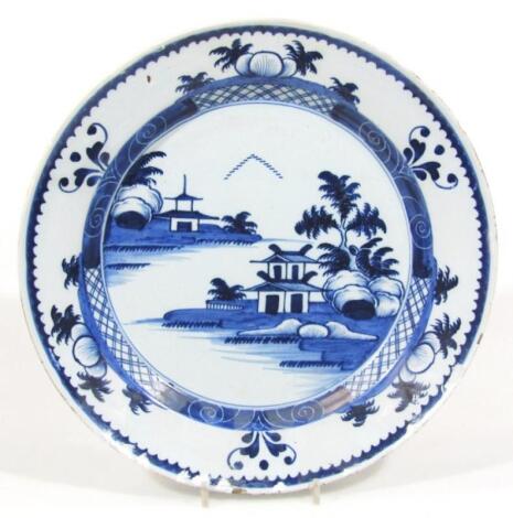 An 18thC blue and white tin glazed earthenware charger