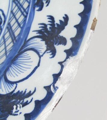 An 18thC blue and white tin glazed earthenware charger - 4