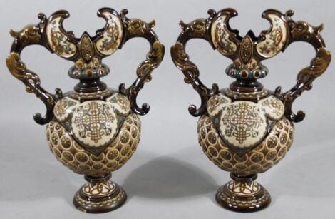 A pair of early 20thC Continental pottery majolica vases