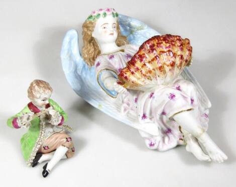 A Continental porcelain angel wall hanging