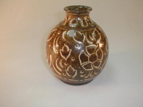 A Doulton stoneware vase of ovoid form with an everted neck rim inscribed "I greet you"