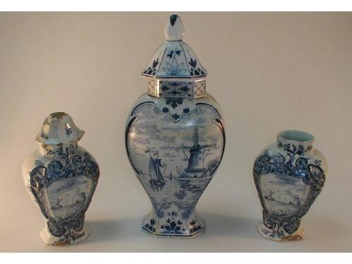 A Delft vase and cover of flattened baluster form painted in underglaze