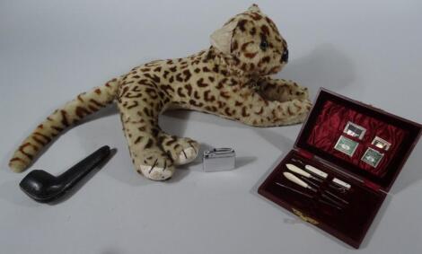 An early 20thC recumbent toy leopard cub