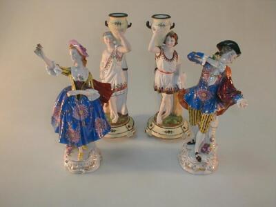 A pair of polychrome bisque figures