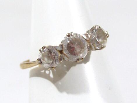 A ladies three stone paste dress ring