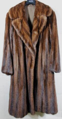 A ladies three quarter length fur style jacket