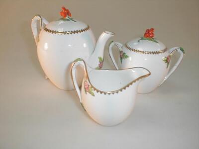 A porcelain three piece tea service