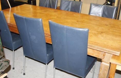 A light wood refectory style dining table