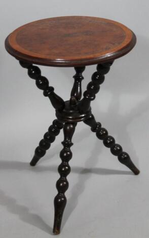 A yew wood and ebonised fortune teller's table