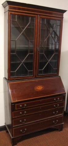 An Edwardian mahogany and boxwood strung bureau bookcase