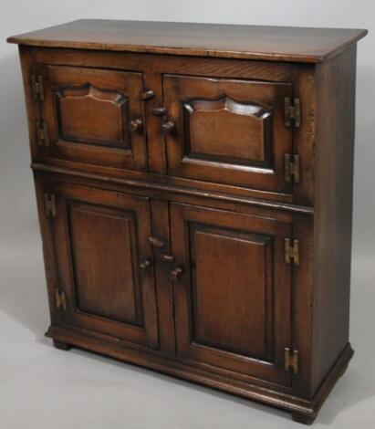 A 20thC Titchmarsh & Goodwin oak Jacobean style cabinet