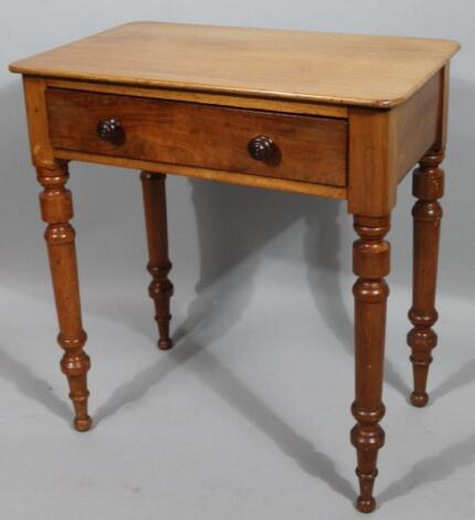 A stripped and lightly polished pine side table