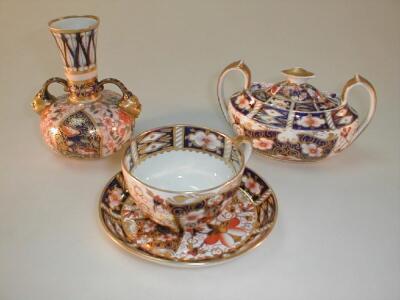 A Royal Crown Derby Old Imari cup and saucer; a 2-handed sugar dish and cover