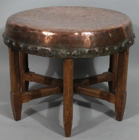 An early 20thC copper and oak Arts and Crafts coffee table