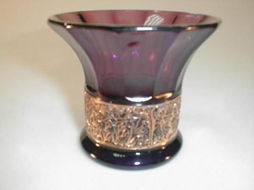 An amethyst glass flared vase with gilt figural band