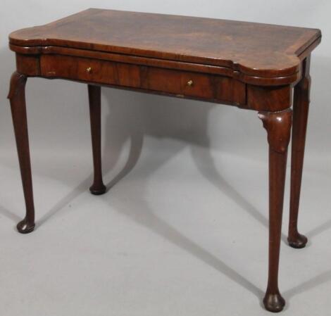 A George III figured walnut card table