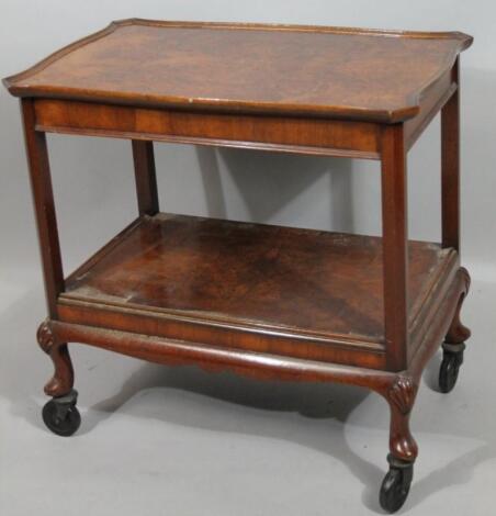 A burr walnut tea trolley.