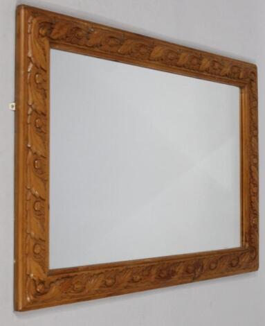 An oblong wall mirror